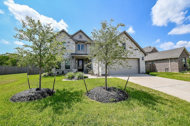 craftsman house featuring a garage and a front lawn