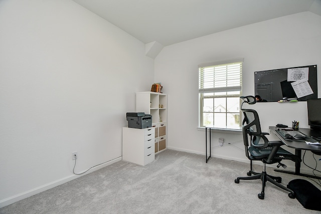 carpeted office space with lofted ceiling