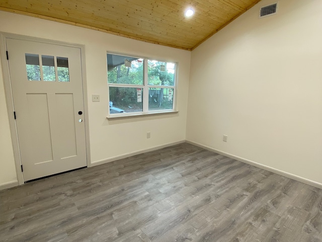 entryway with vaulted ceiling, wooden ceiling, and hardwood / wood-style flooring