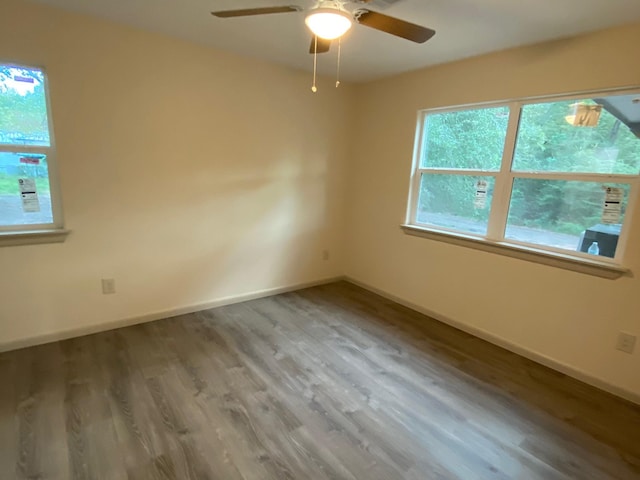 626 Hines Rd, Point Blank, TX 77364 - unfurnished room featuring wood finished floors, a ceiling fan, and baseboards