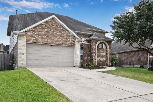 view of front of house featuring a garage and a front yard