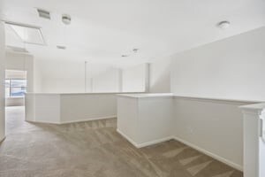 unfurnished room with light carpet