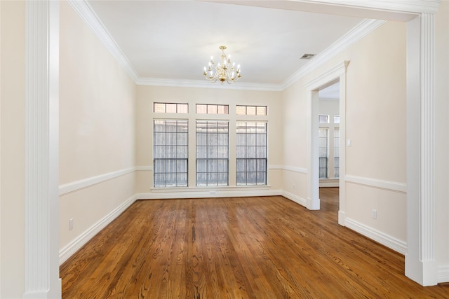 unfurnished dining area featuring a notable chandelier, wood-type flooring, and ornamental molding