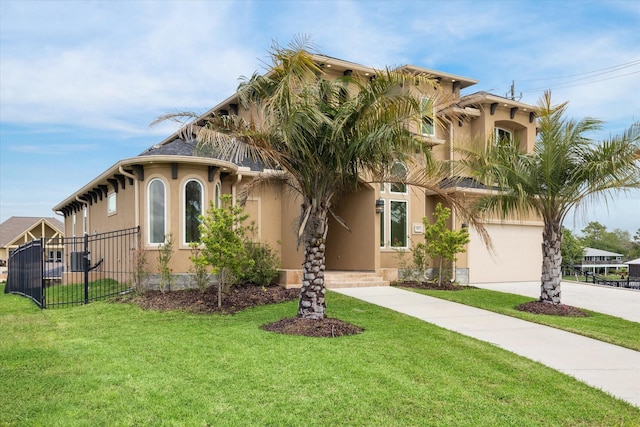 view of front of house featuring stucco siding, fence, a garage, driveway, and a front lawn