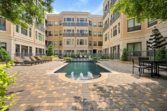 view of pool with a patio area