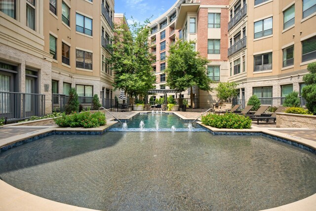 view of pool featuring pool water feature