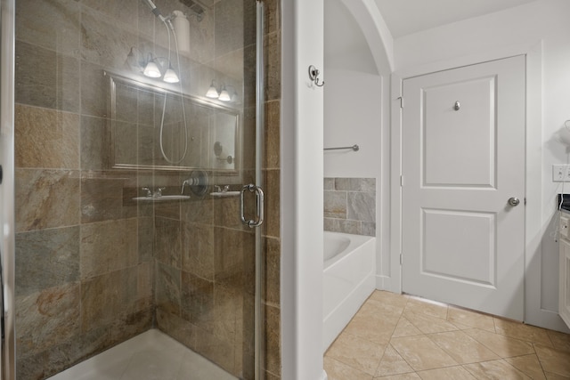 bathroom with plus walk in shower, tile patterned floors, and vanity