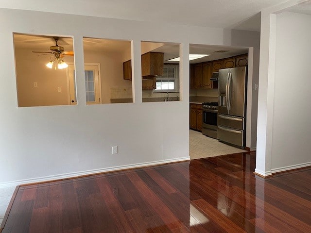 interior space featuring light wood-type flooring and ceiling fan