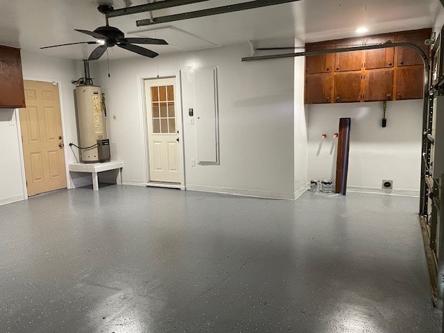 garage with gas water heater and ceiling fan