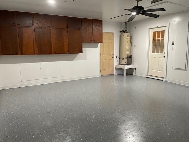 garage with gas water heater and ceiling fan