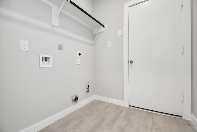 laundry room with light hardwood / wood-style floors, washer hookup, gas dryer hookup, and hookup for an electric dryer