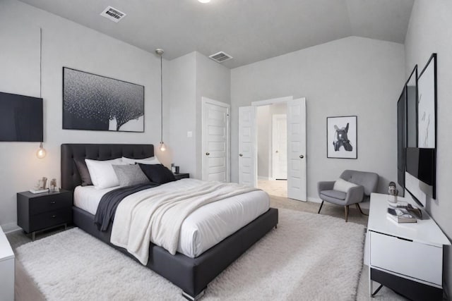 bedroom featuring lofted ceiling