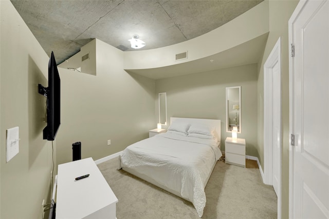 bedroom with light colored carpet