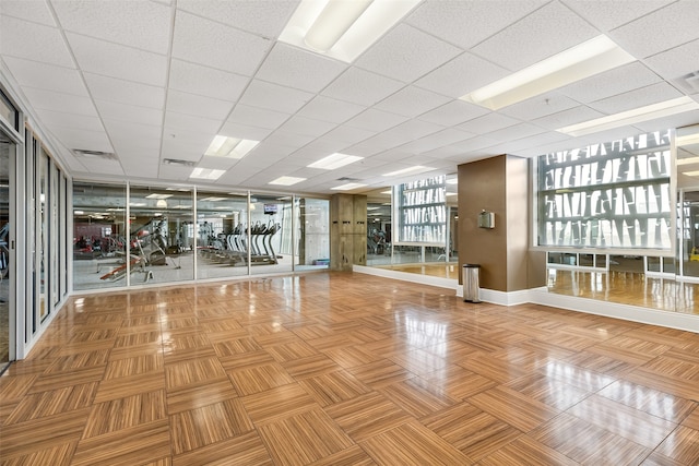 workout area featuring a drop ceiling