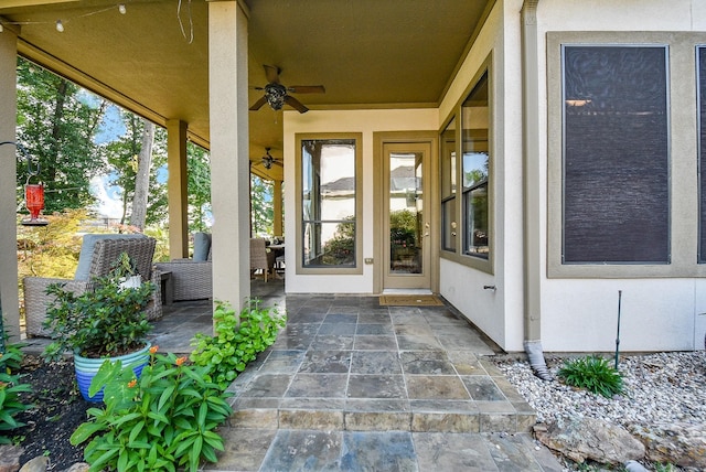 property entrance featuring ceiling fan and a patio area