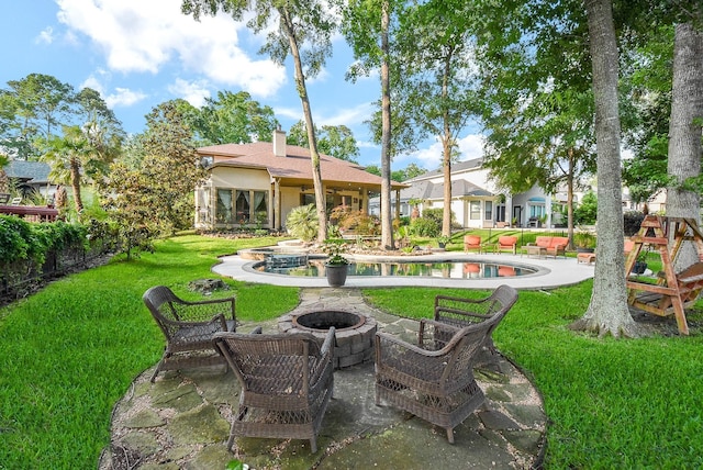 view of yard with a patio area and a fire pit