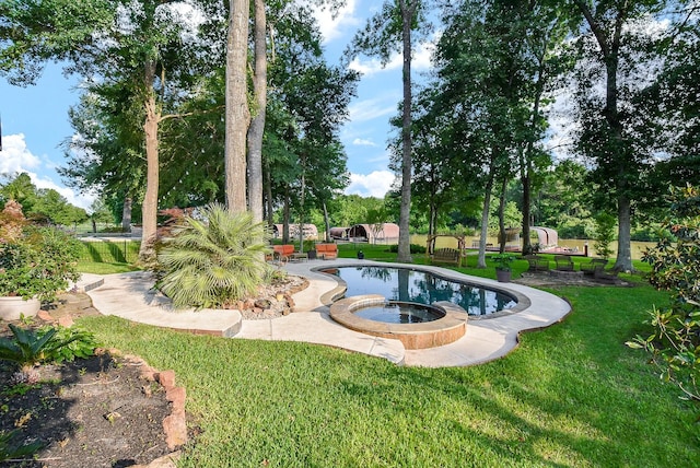 view of community with a lawn and a jacuzzi