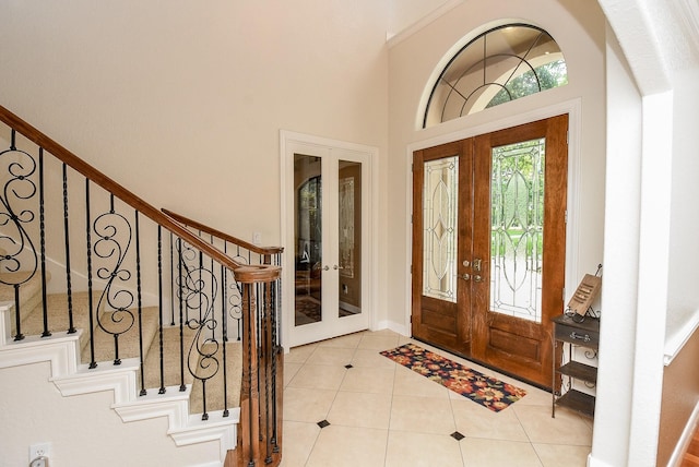 tiled foyer featuring french doors