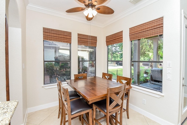 dining space with ceiling fan, ornamental molding, light tile patterned floors, and a wealth of natural light