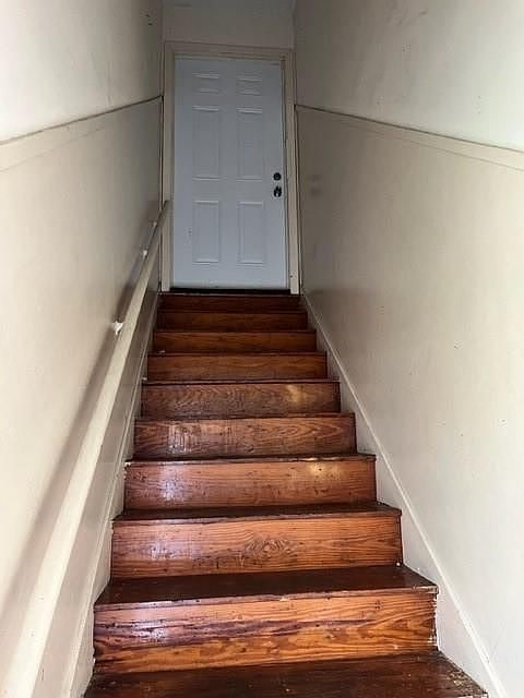2410 Milby St, Houston, TX 77004 - stairs featuring wood finished floors
