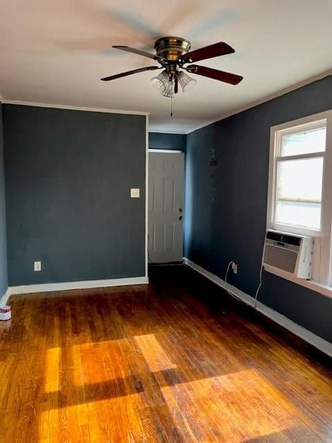 2410 Milby St, Houston, TX 77004 - empty room with crown molding, cooling unit, hardwood / wood-style flooring, and baseboards