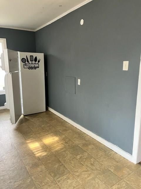 2410 Milby St, Houston, TX 77004 - spare room with baseboards and ornamental molding