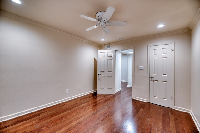 unfurnished bedroom with ceiling fan, dark wood-type flooring, and ornamental molding