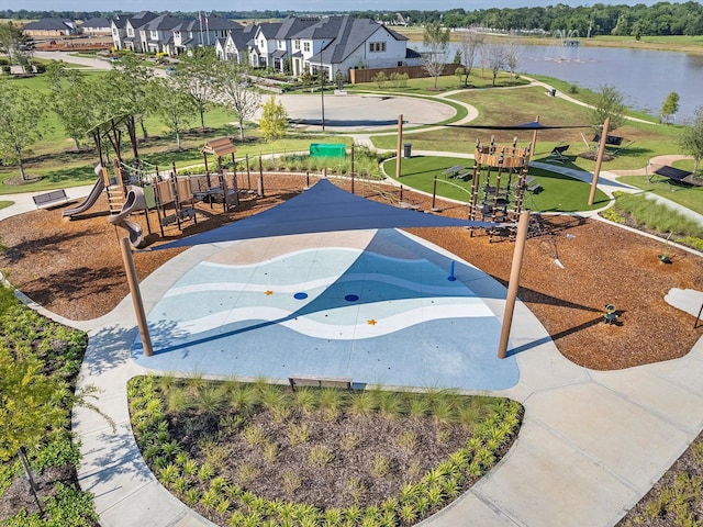 view of property's community featuring a playground and a water view