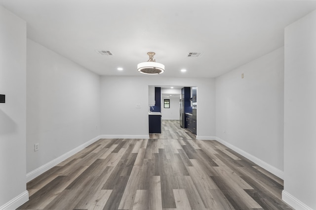 empty room with hardwood / wood-style floors