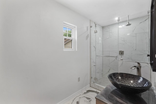 bathroom featuring tile patterned floors, a shower with door, and vanity