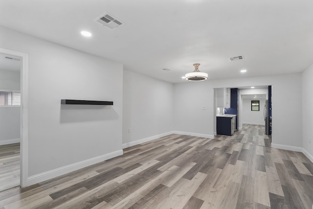 unfurnished room featuring hardwood / wood-style flooring