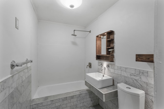 full bathroom featuring ornamental molding, sink, shower / bathtub combination, tile walls, and toilet