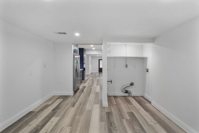 laundry area featuring light hardwood / wood-style flooring and washer hookup