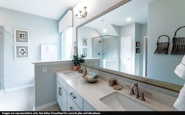 bathroom with vanity, a shower with shower door, and tile patterned floors