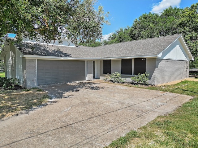 ranch-style home with a garage