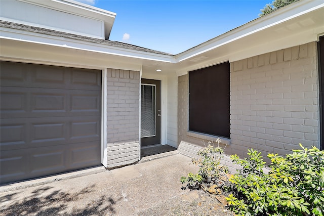 property entrance with a garage