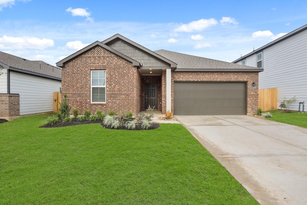 25300 Carnation Ct, Montgomery, TX 77316 - view of front of property with brick siding, an attached garage, concrete driveway, and a shingled roof