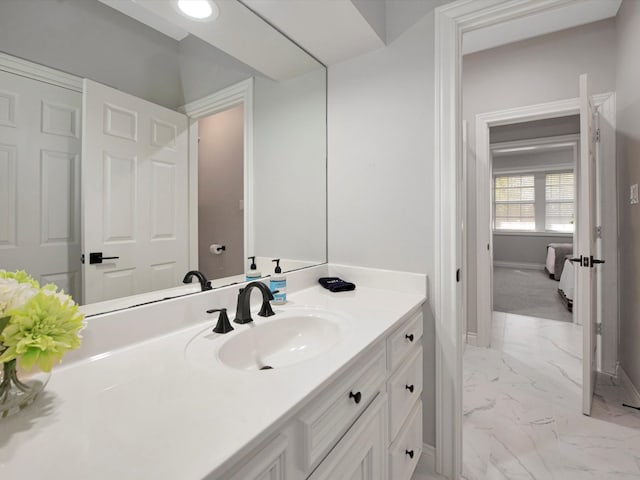 bathroom with tile patterned flooring and vanity