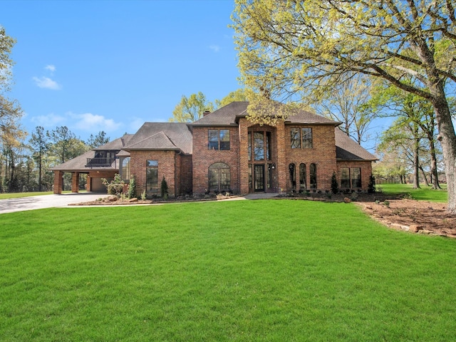 view of front facade featuring a front lawn and a carport