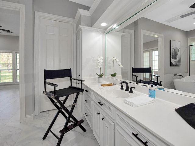 bathroom featuring ceiling fan, a bathtub, tile patterned flooring, and vanity