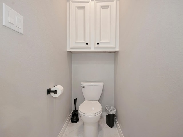 bathroom featuring toilet and tile patterned floors