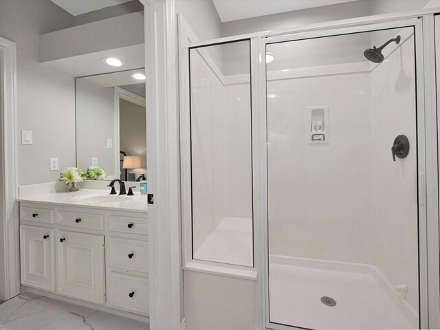 bathroom with tile patterned flooring, a shower with shower door, and vanity