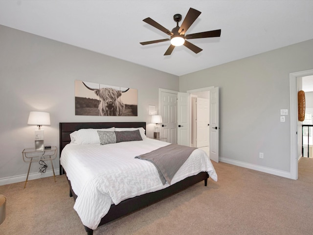 bedroom with light colored carpet and ceiling fan