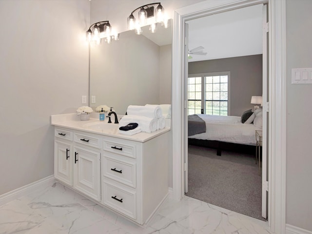 bathroom with tile patterned floors, vanity, and ceiling fan