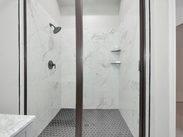 bathroom featuring an enclosed shower and vanity