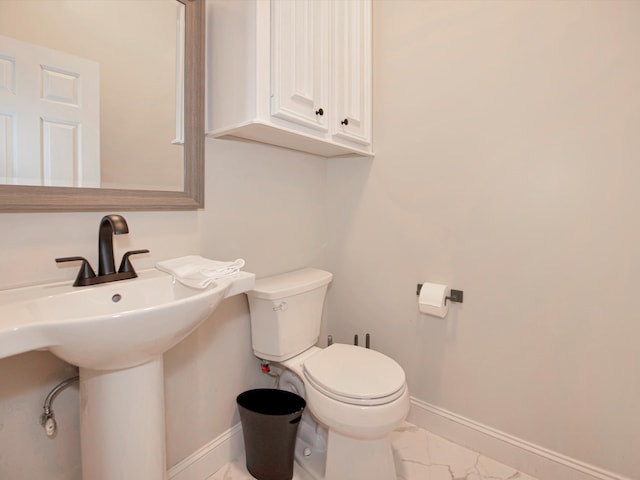 bathroom featuring tile patterned flooring and toilet