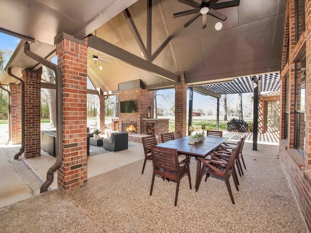 view of patio with ceiling fan and an outdoor brick fireplace