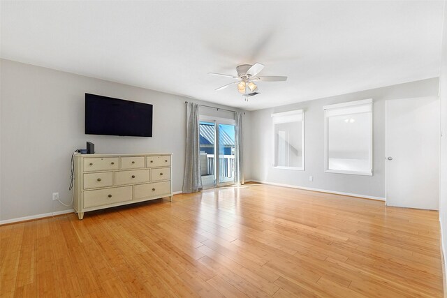 unfurnished bedroom featuring ceiling fan, light hardwood / wood-style floors, and access to exterior