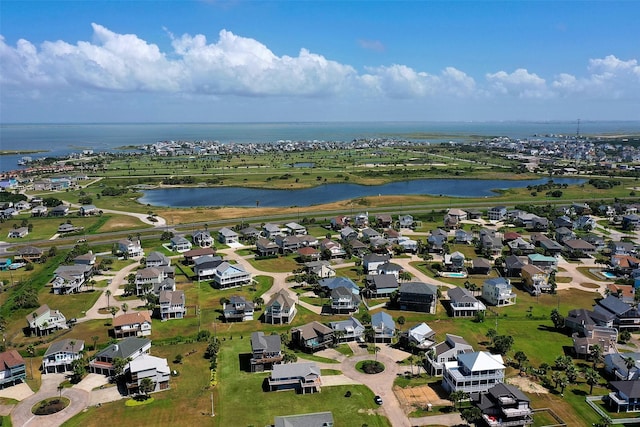 drone / aerial view featuring a water view and a residential view