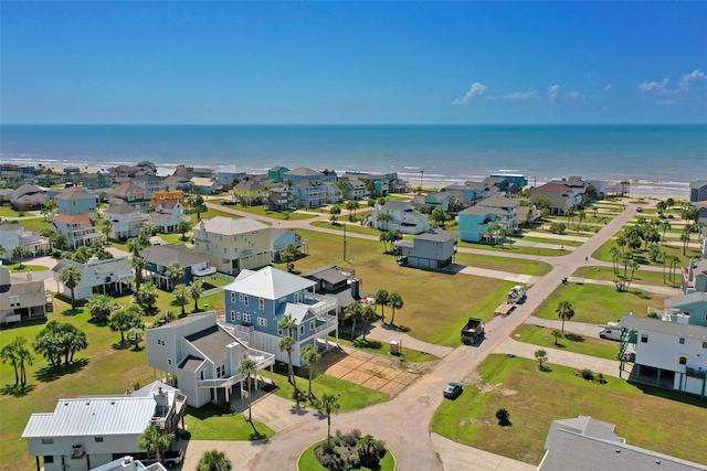 drone / aerial view featuring a water view and a residential view